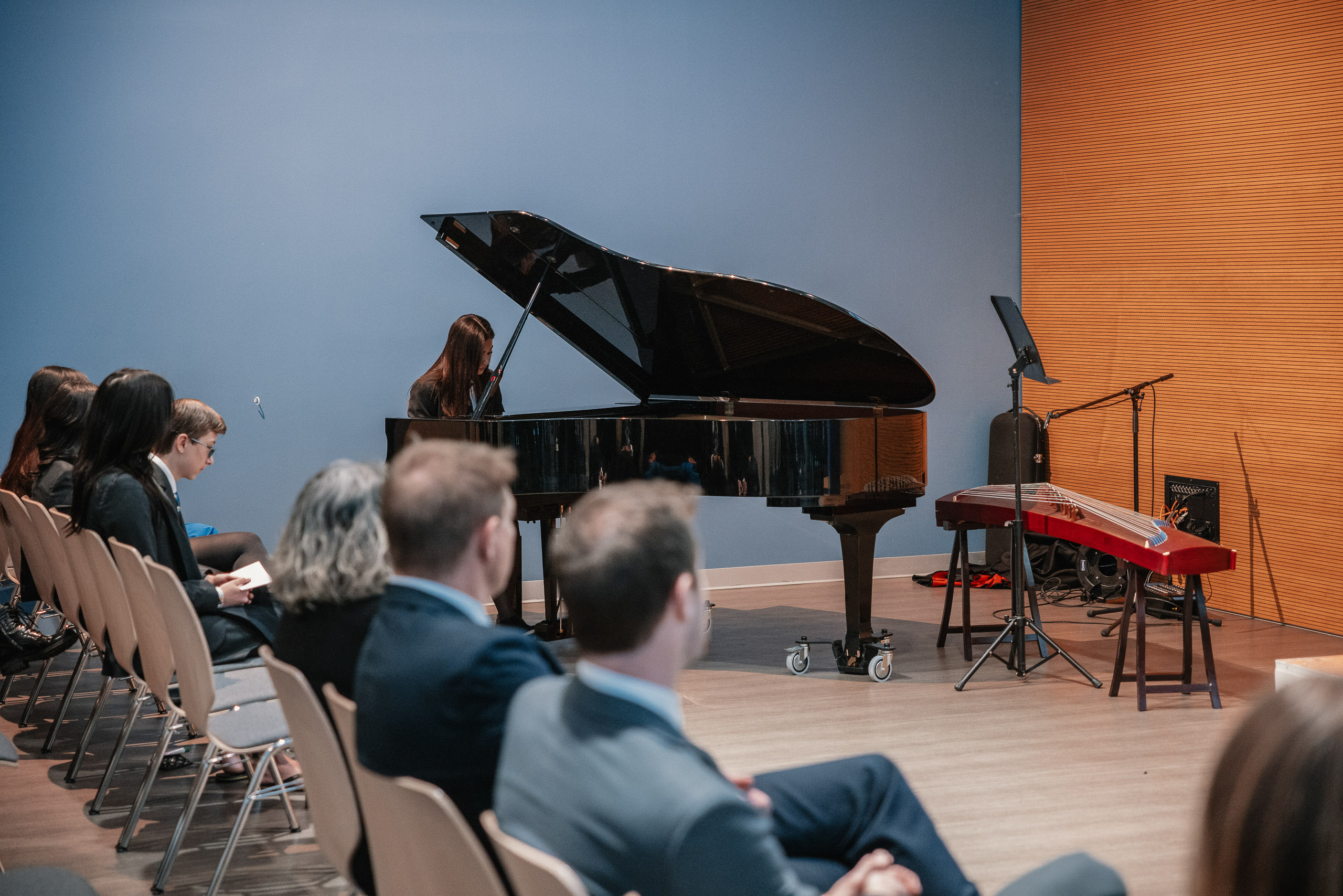 Student performing at a piano recital